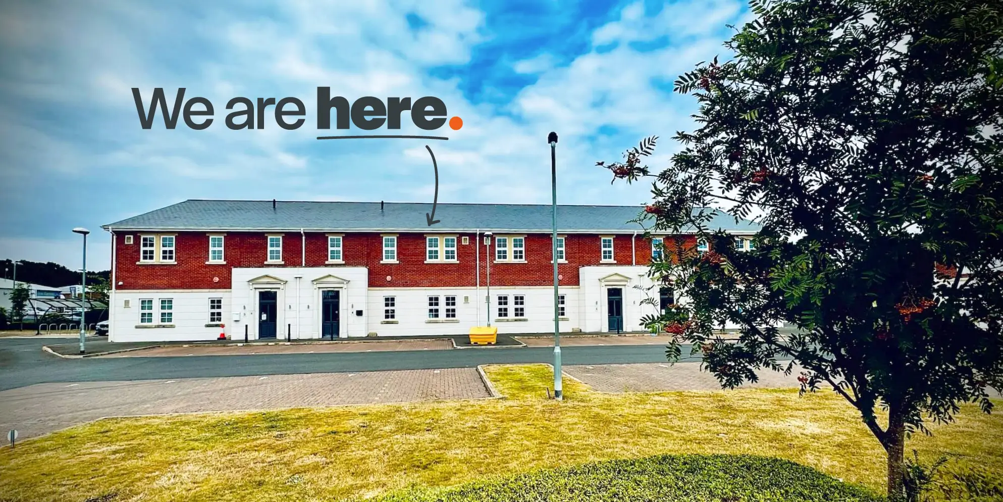 The Sourcefour Office Building with a We are here illustration and arrow pointing down