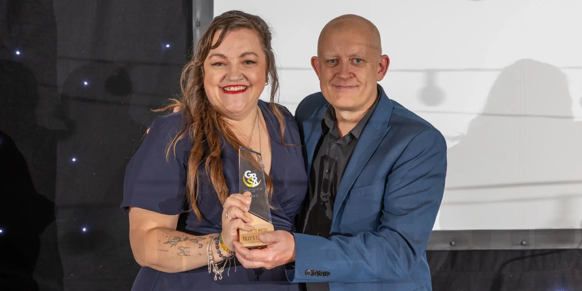 Sourcefour MD Rob presenting Becky from Tilly's Tutoring with the One to Watch award at the 2025 Great Big Small Awards